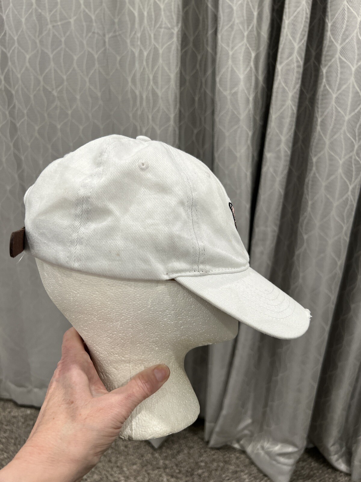 White with Pink black embroidered butterfly on the front. Adj. Cap Hat