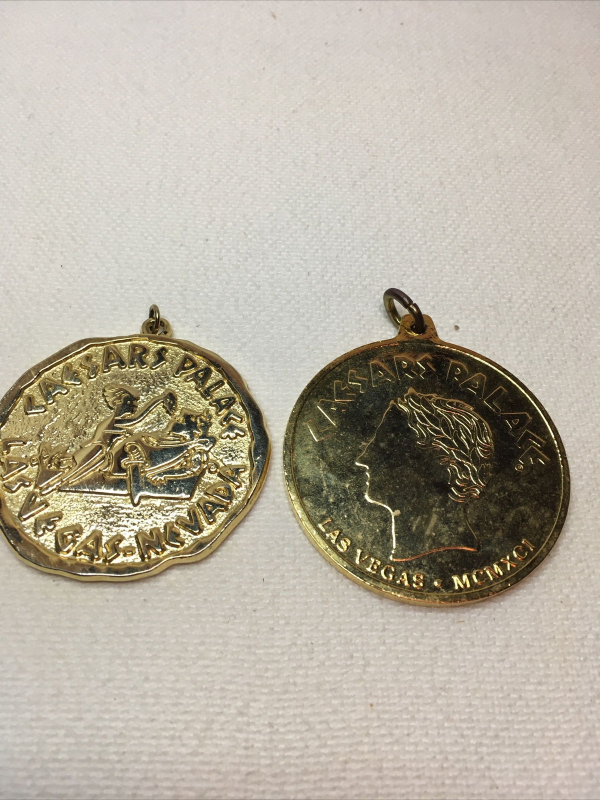 Lot of 2 Large Heavy Goldtone Caesars’s Palace Las Vegas Pendants