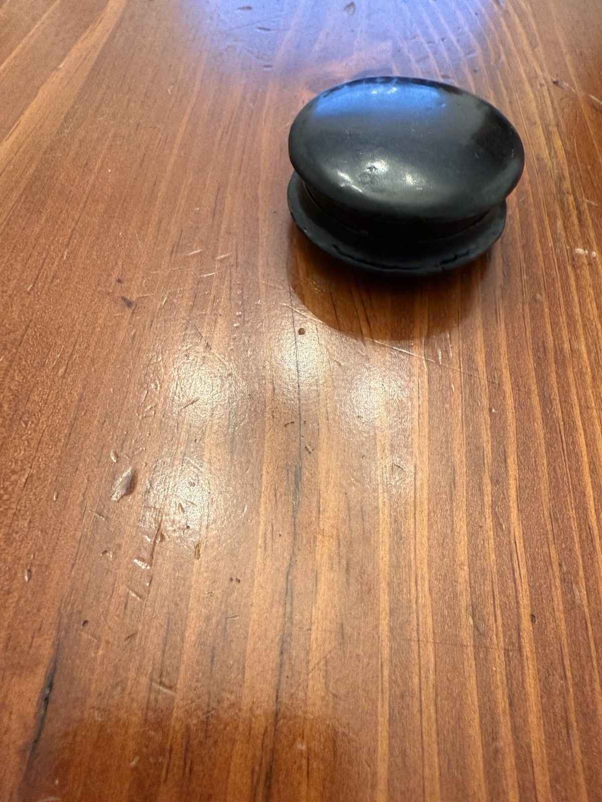 A modern decorative round case with iridescent inlay.