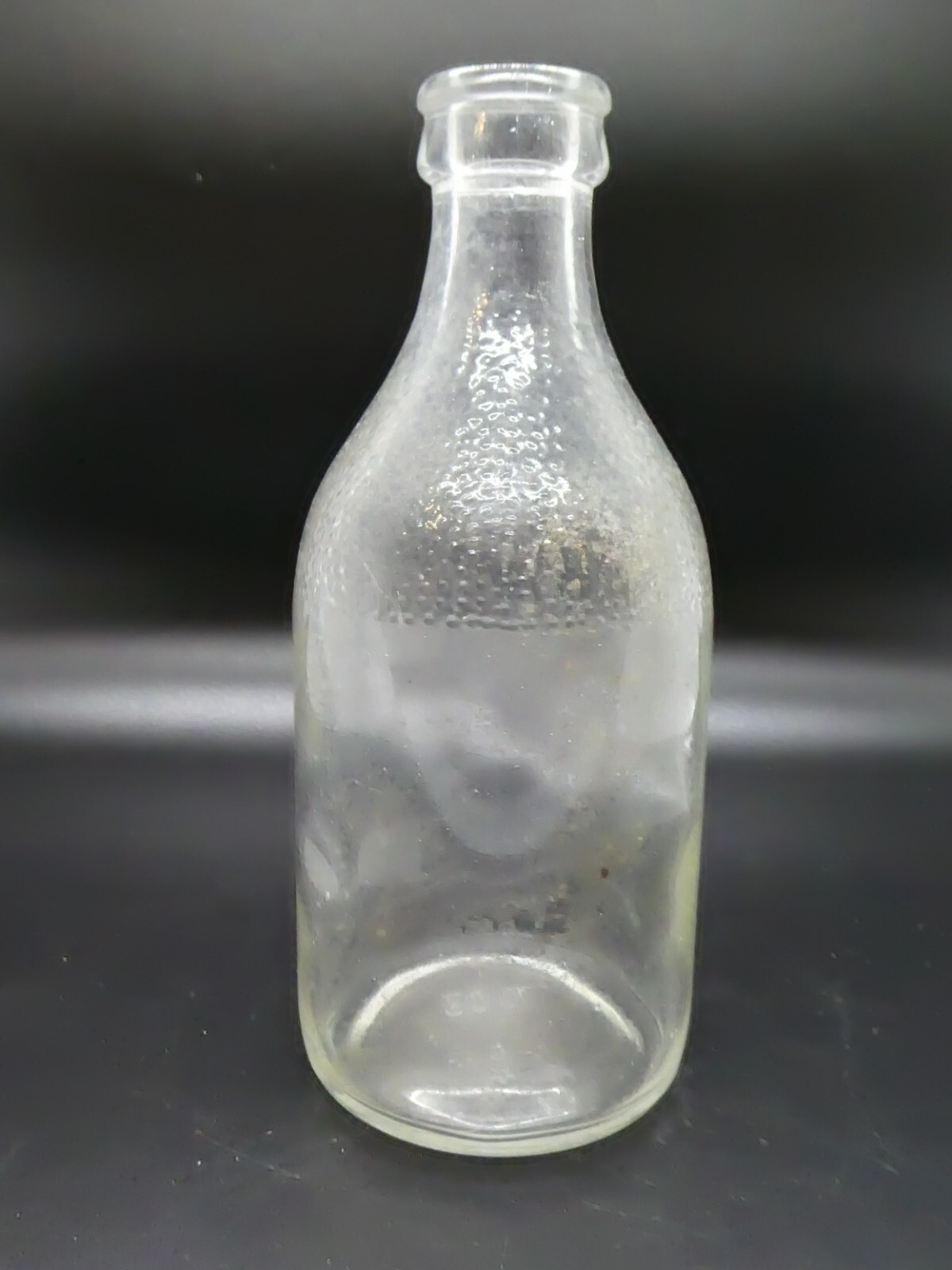 Vintage Small Clear Glass Bottle Patterned on Top 5.5" x 2"