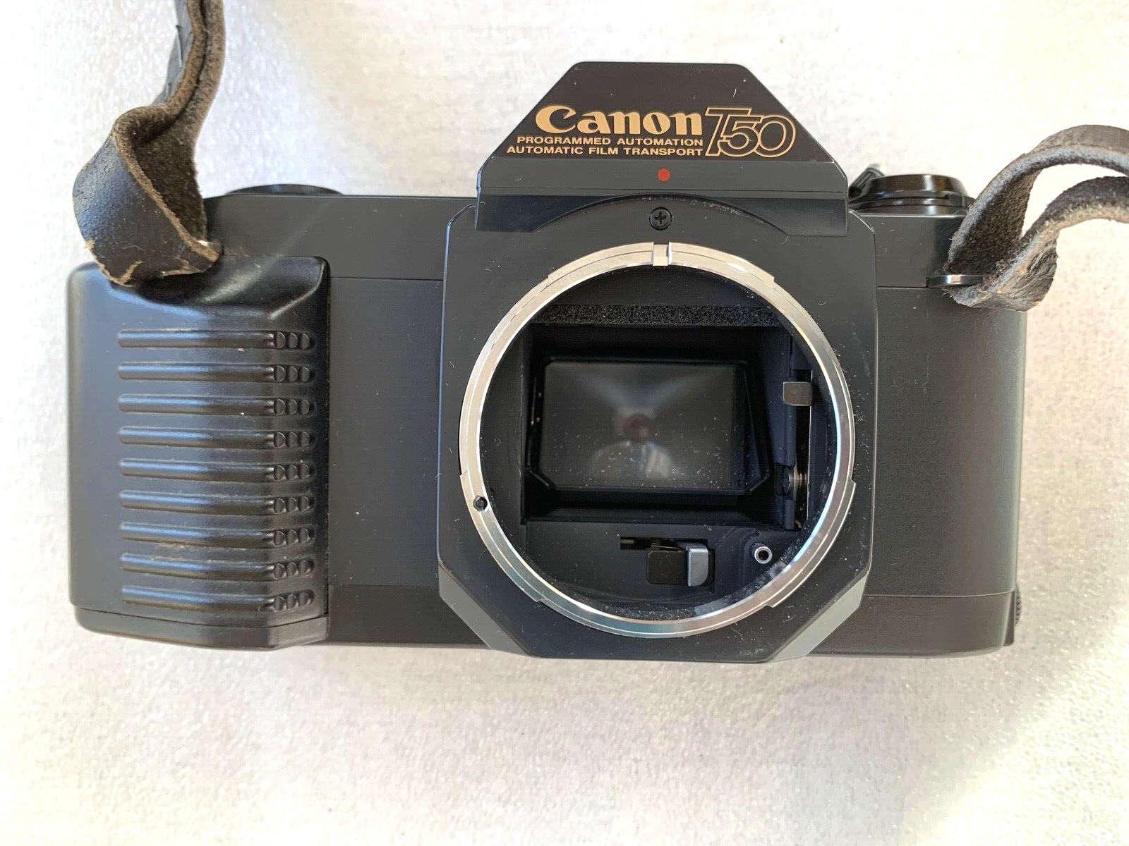One Canon T50 35mm SLR Film Camera W/Body Cap in excellent working conditions