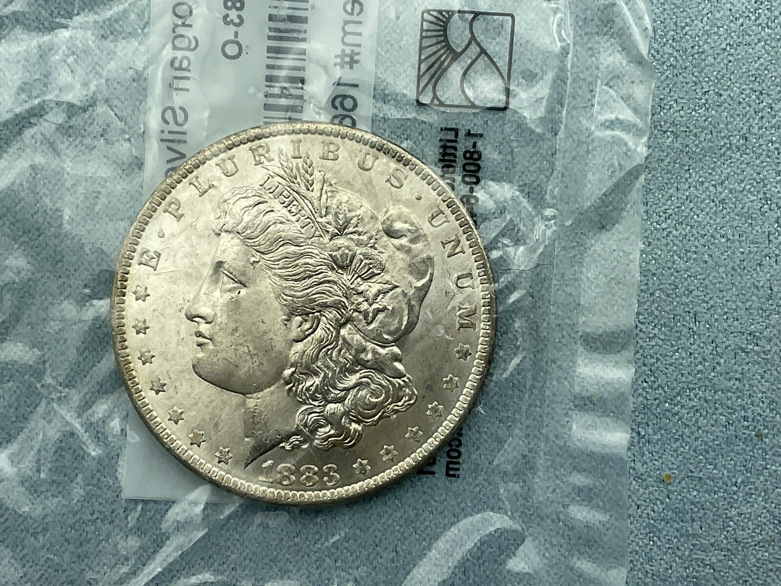 1883-O Morgan Dollar Uncirculated 90% Silver $1 US Coin Sealed by Littleton Coin