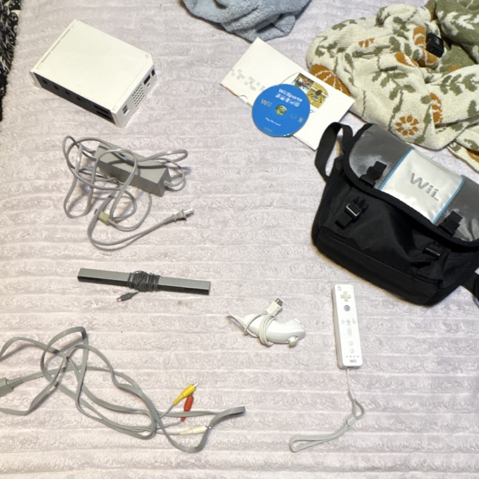 Wii Console Bundle with Wii Sports, Remote, Nunchuk, Sensor Bar, Travel Bag