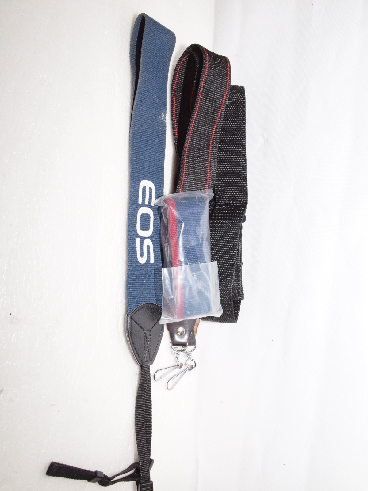 Canon camera straps- 1 new in package includes Canon EOS wide strap.