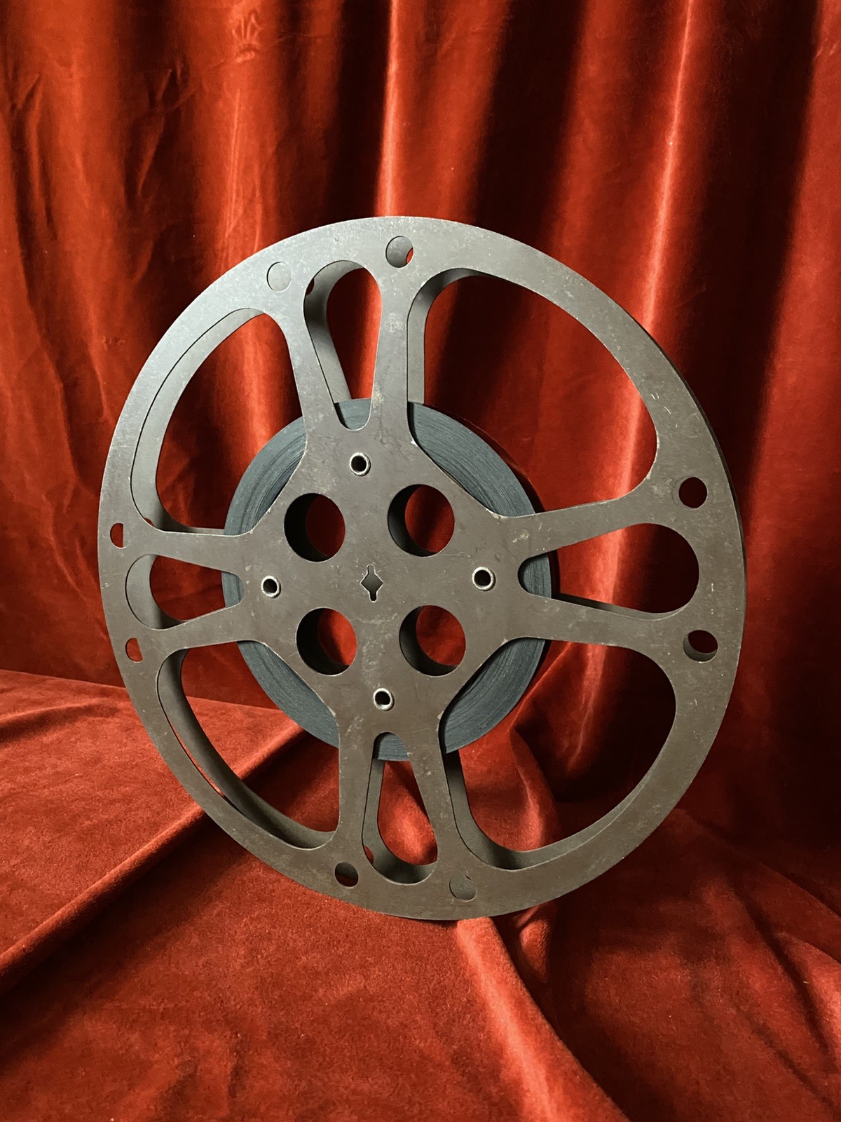 1200 ft Metal Moving Picture Reel 12 1/4”  With a piece of an unknown film