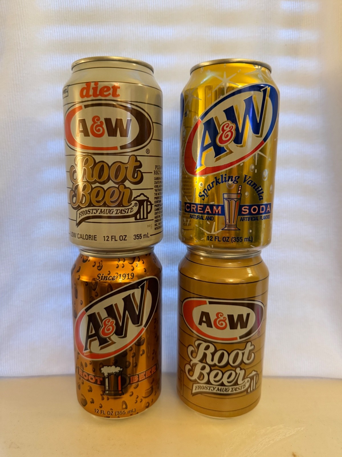 Four A&W Root Beer cans from the 1990's 12oz each