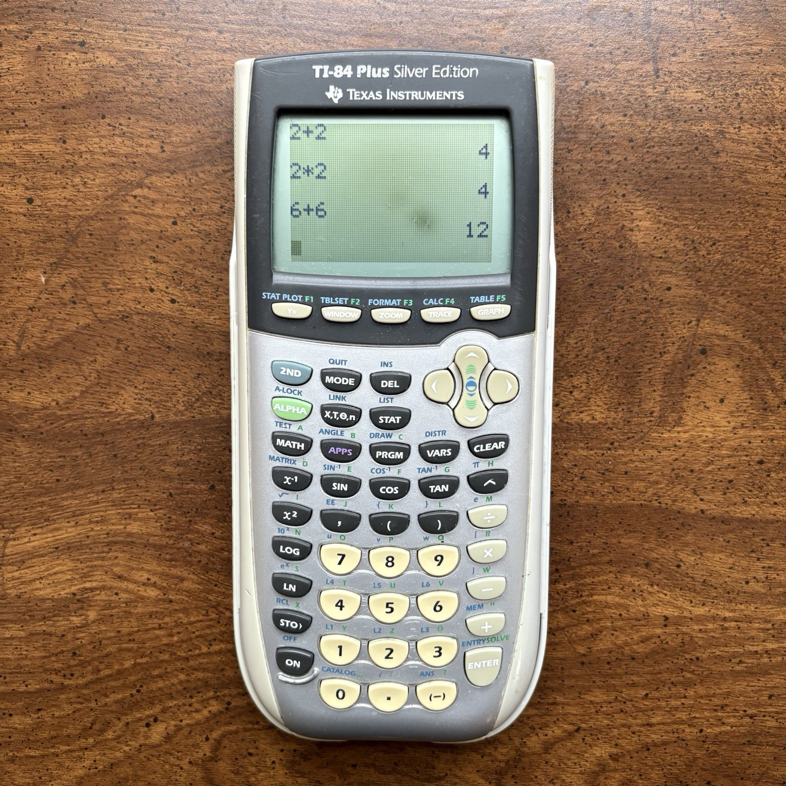 Texas Instruments TI-84 Plus Silver Edition Graphing Calculator in Gray