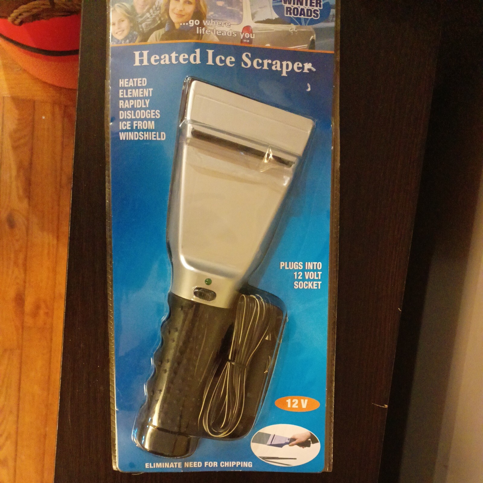 Heated Ice Scraper Rapidly Dislodges Ice Cream Windshield Nip
