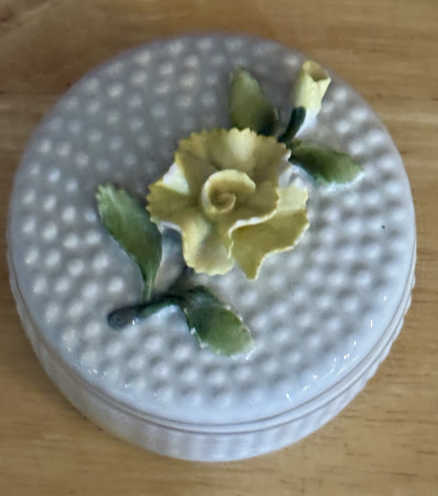 Trinket Box w/ A textured, dotted surface decorated w/ yellow flower; Germany