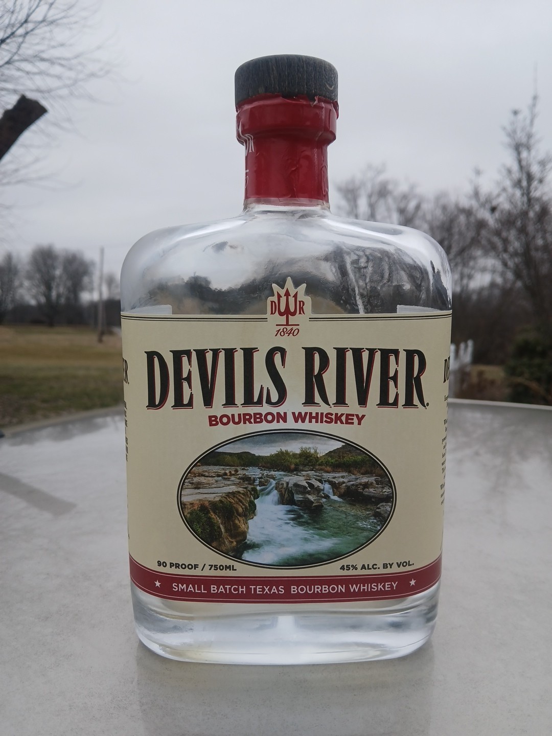 Empty Corked Bottle Of Devil's River Barrel Bourbon Whiskey