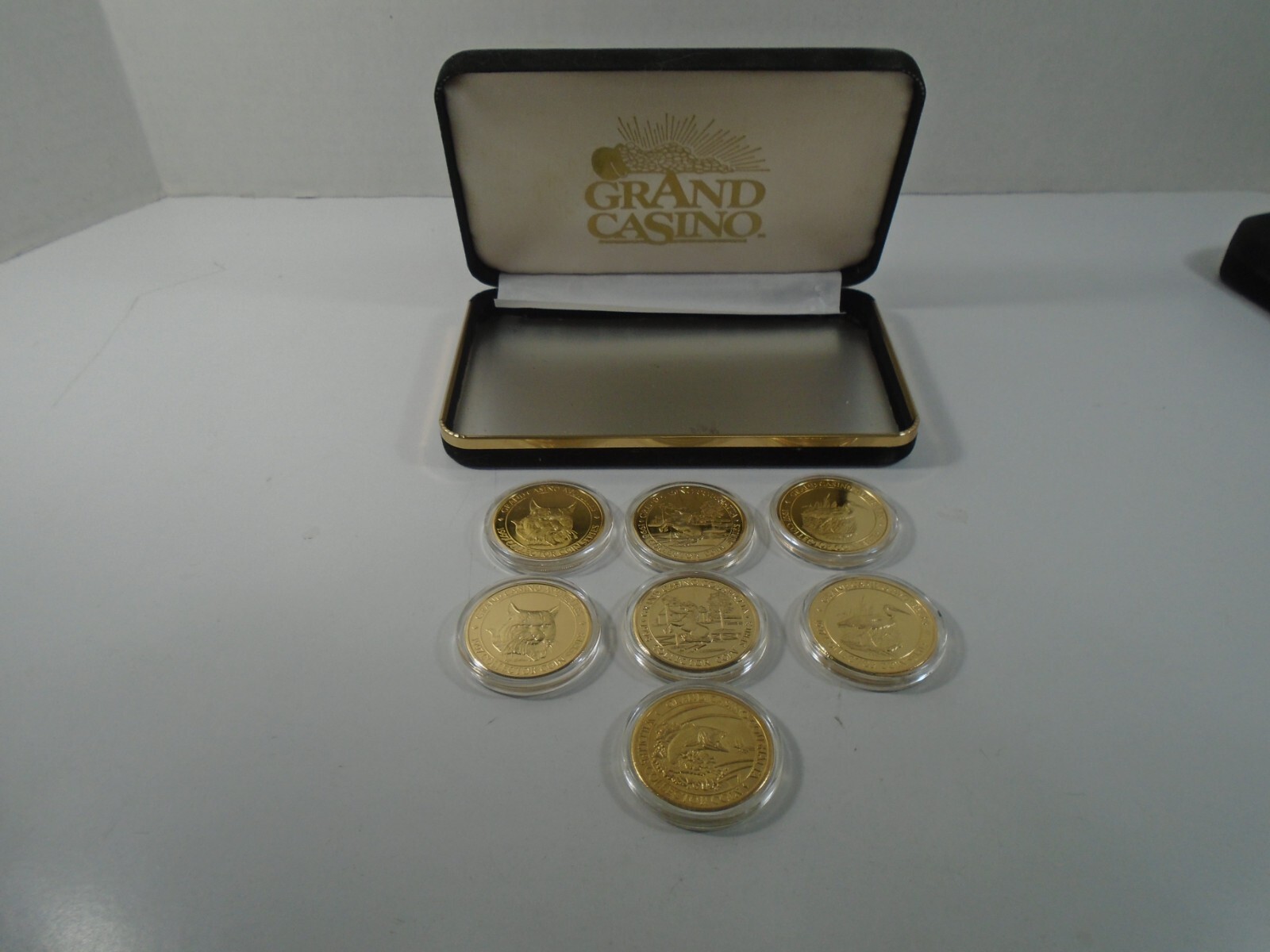 LOT OF 7--1997 / 1998 GRAND CASINO COINS (LOOK) LOT #1