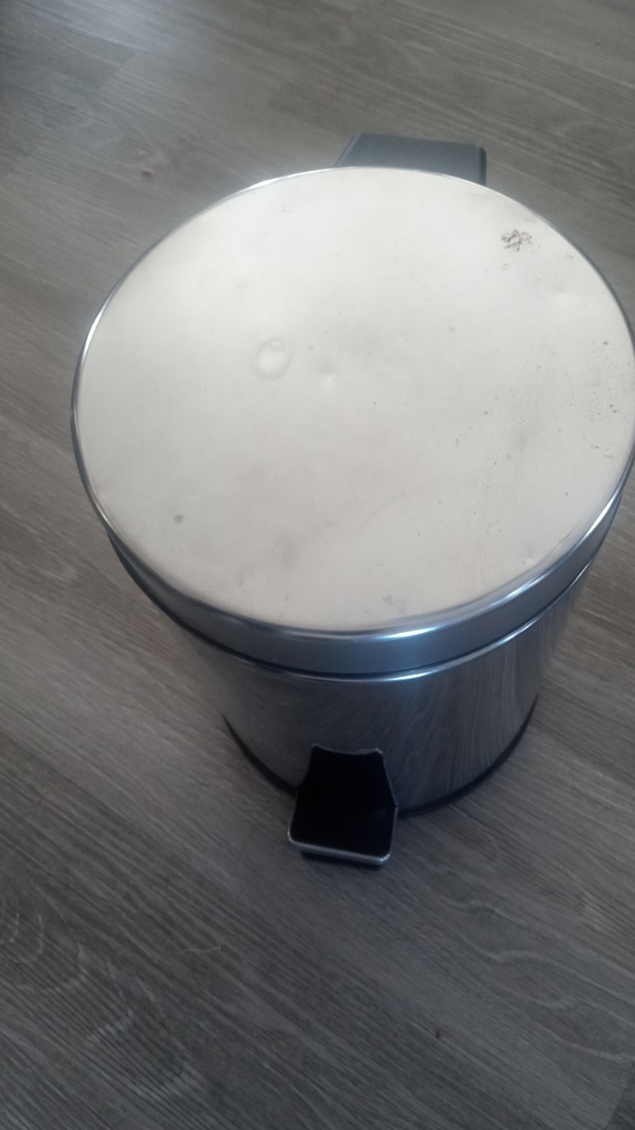 Small gray trash can