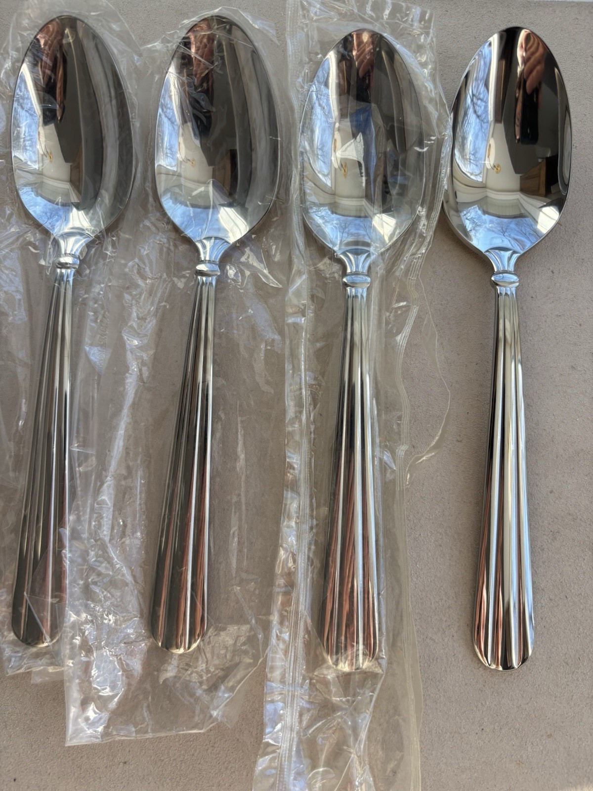 Oneida - UNITY - lot of 4 place/oval soup spoons NEW