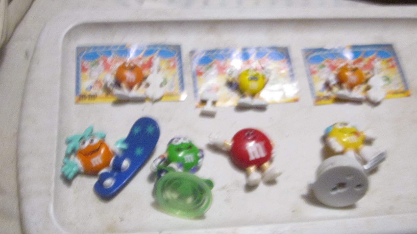 seven Assorted French Pocket Suprises & miniature m&m's  miniatures lot 8