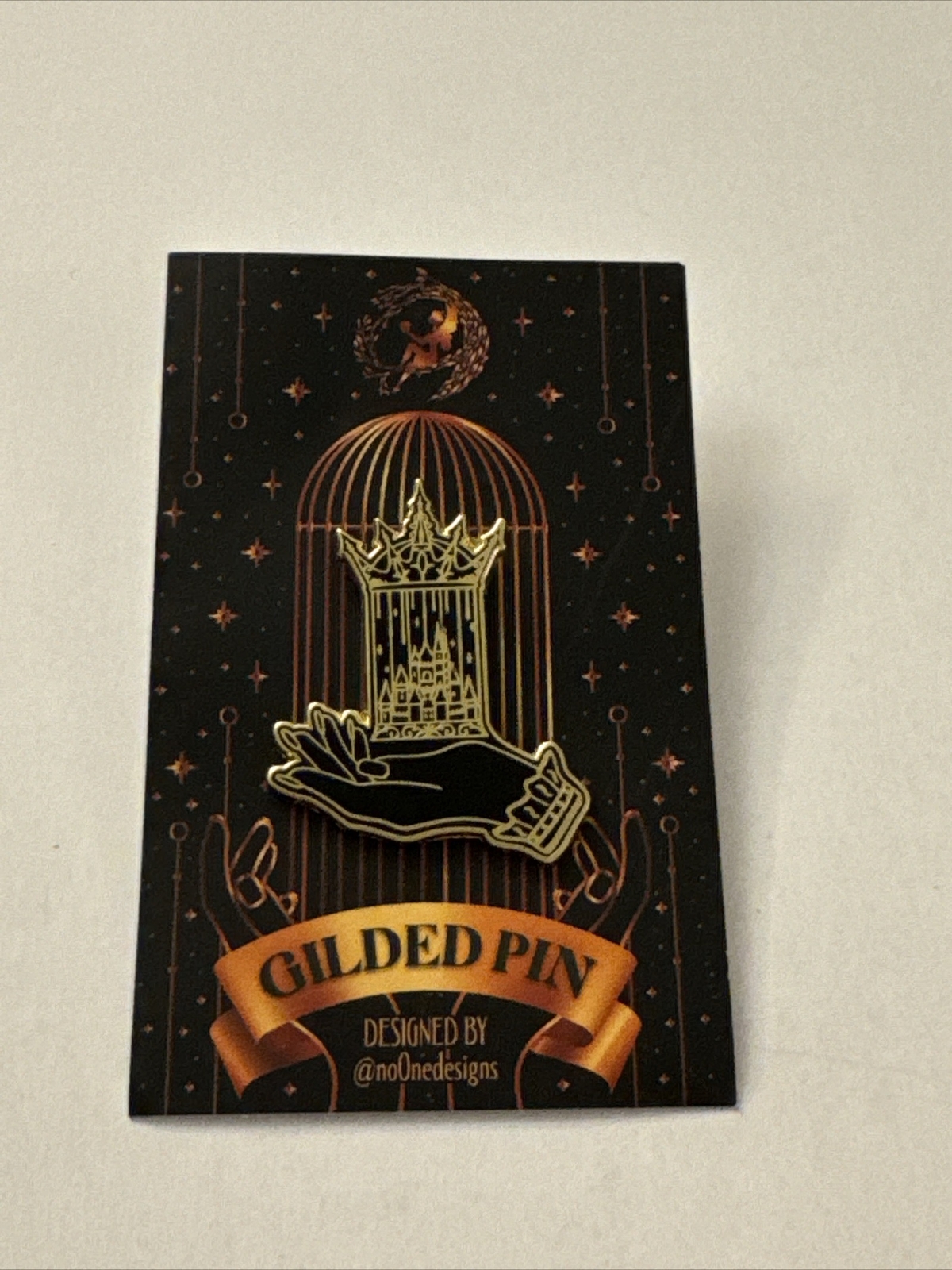 Fairyloot Gilded Pin Hand holding Birdcage Castle Crown Bookish Pin MA1