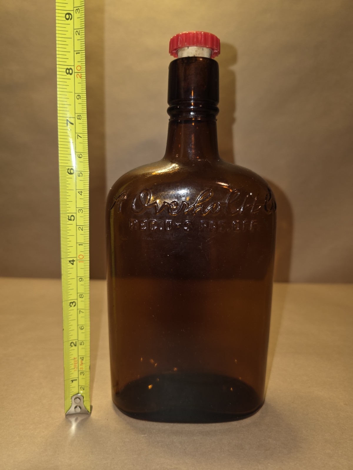 Antique OVERHOLT FULL PINT AMBER BOTTLE WITH CAP 8.5 INCHES TALL GREAT CONDITION