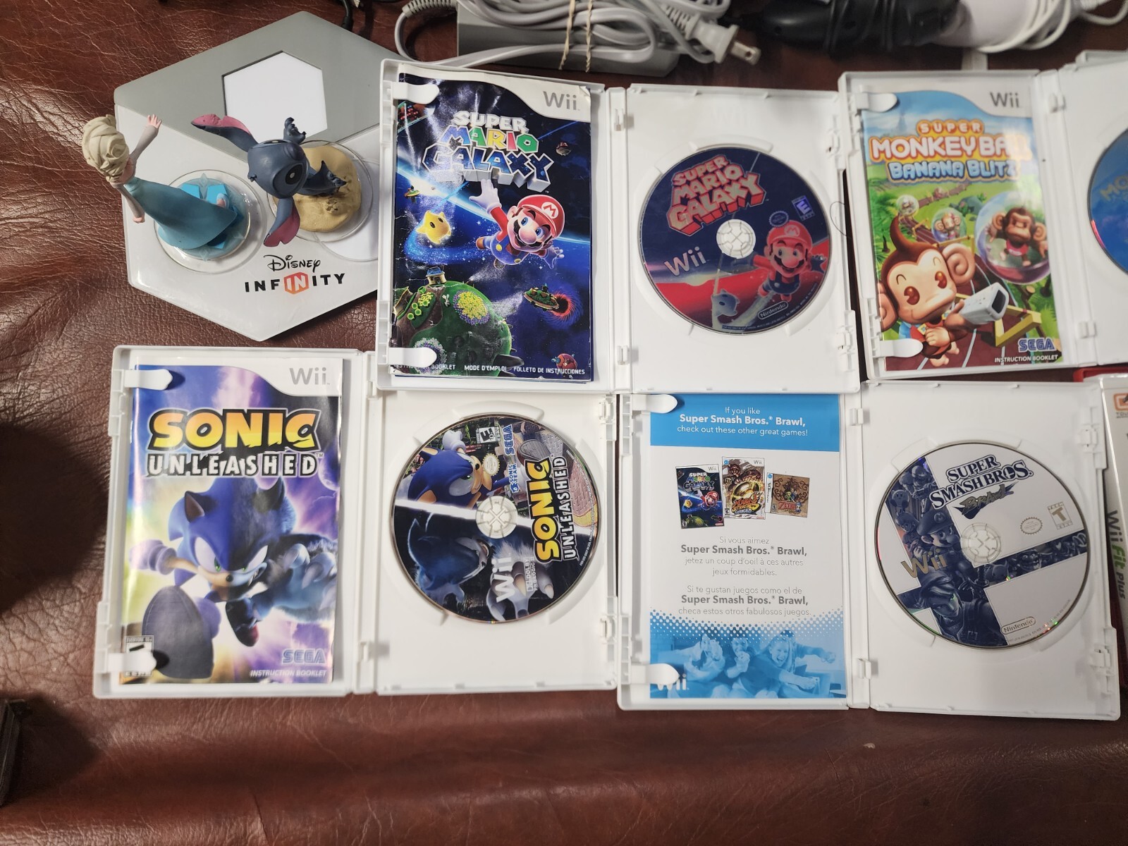 Wii Console plus, 9 games, 2 remotes, 1 nunchuck, System Plus Hookups & More