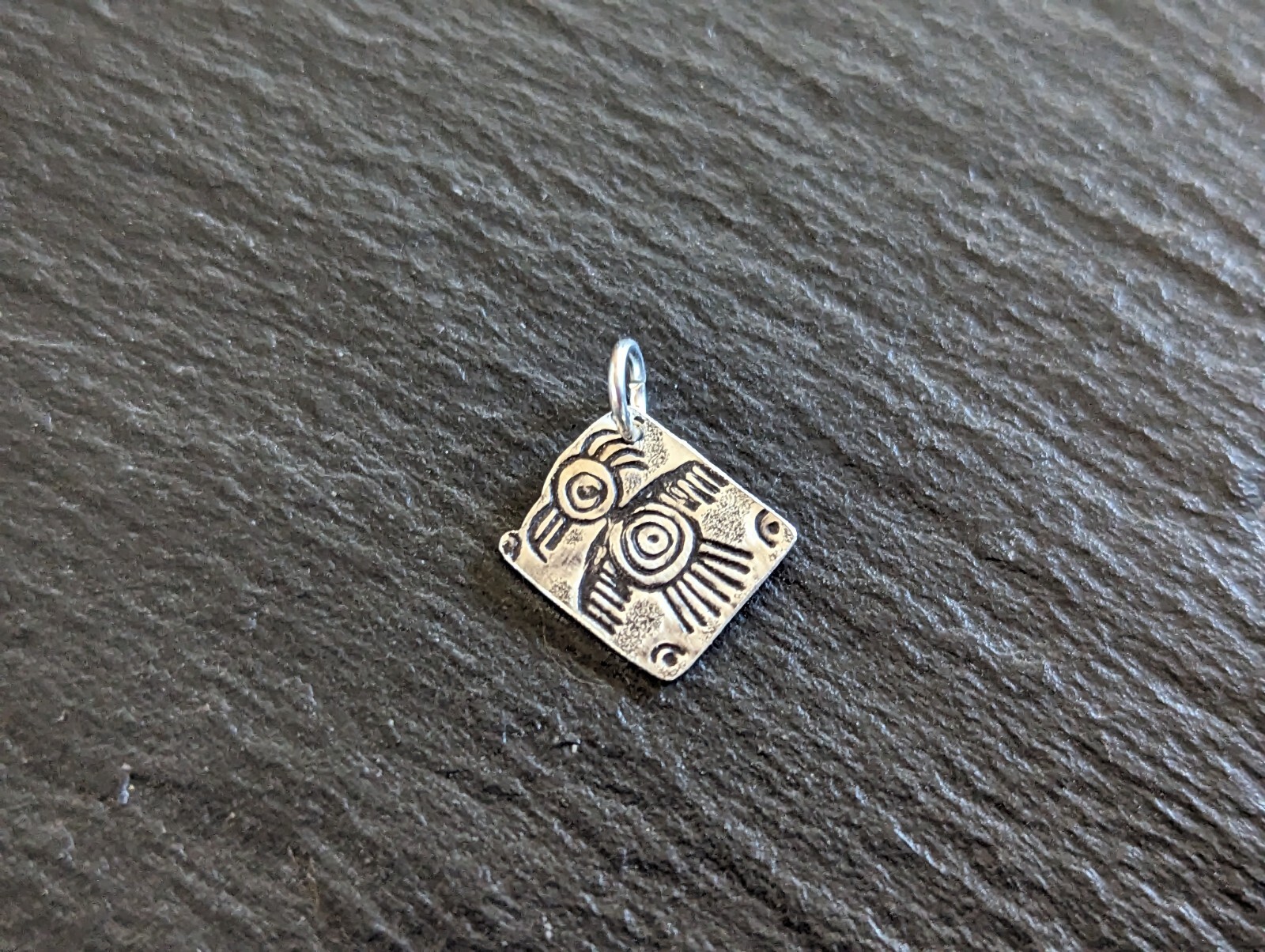Tiny sterling silver charm with a bird sumbol - handmade - freeform