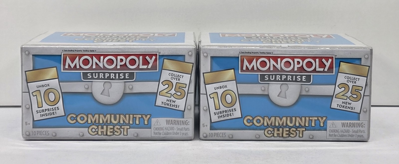 Monopoly SURPRISE Community Chest Blue w. 10 Surprises 25 tokens to collect