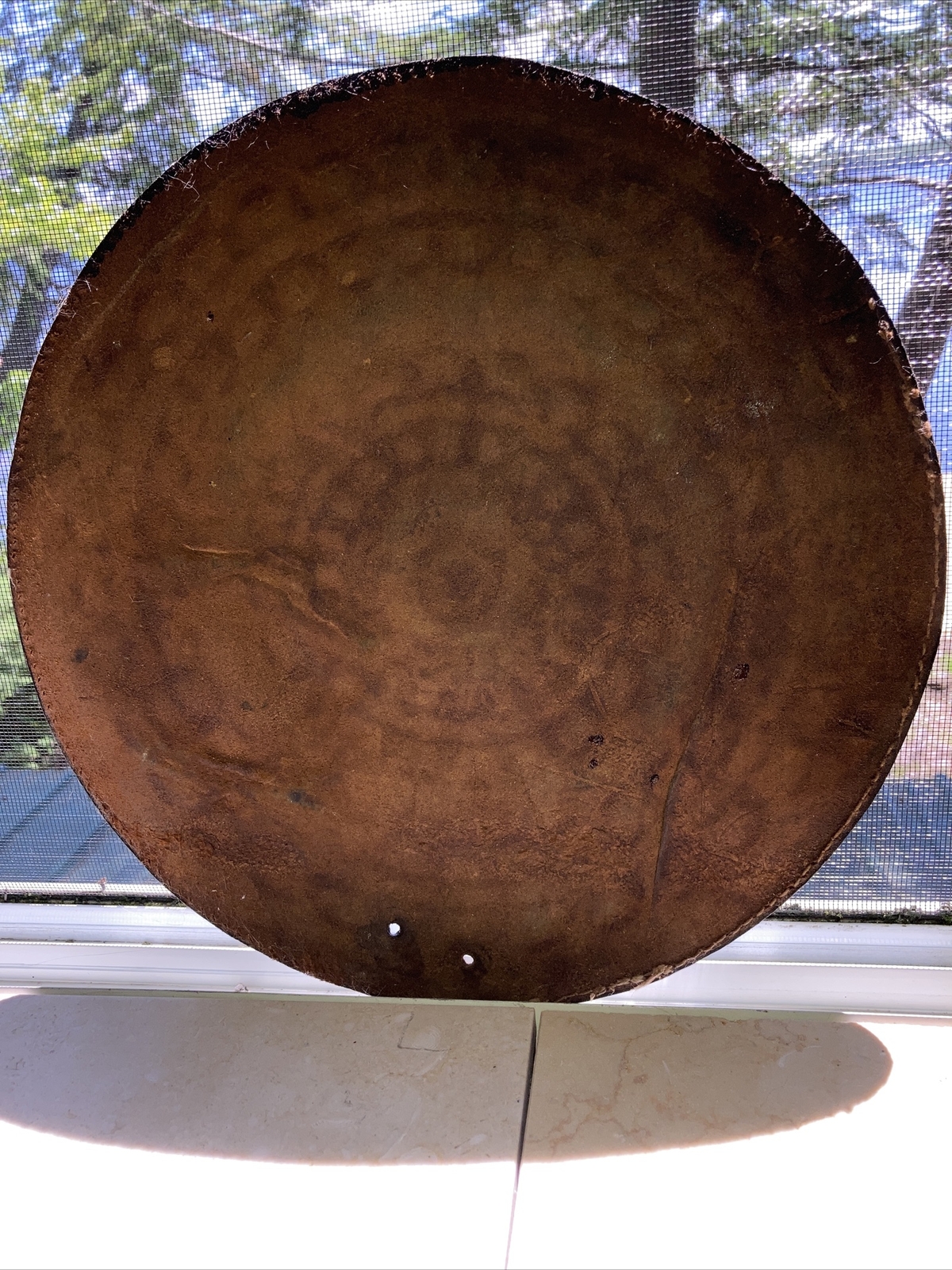 vintage embossed circular 12” leather piece