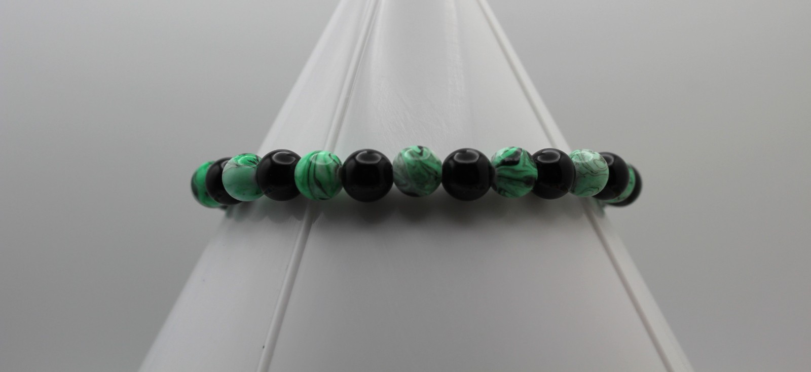 Handcrafted 9.0" black glass and green swirled acrylic beads bracelet