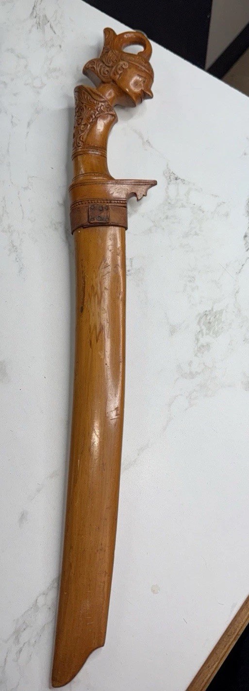 keris dagger with a wooden hilt