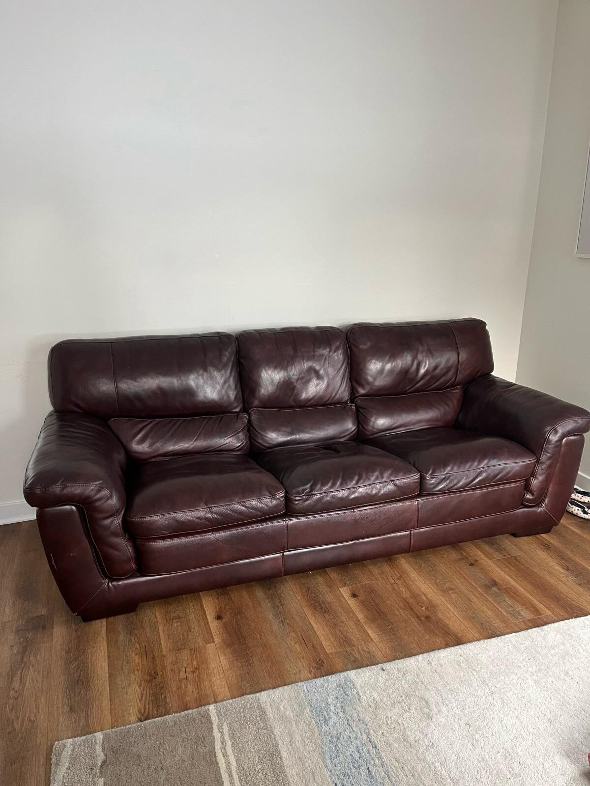 Brown faux leather couch used. Great conditions