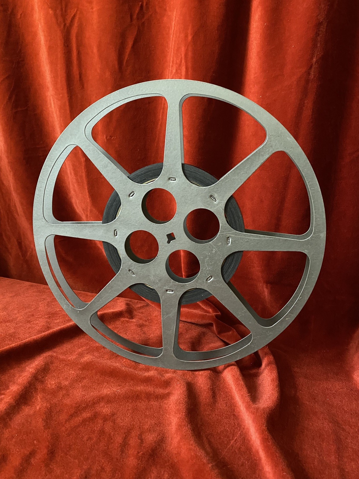 1200 ft Metal Moving Picture Reel 12 1/4”  With a piece of an unknown film