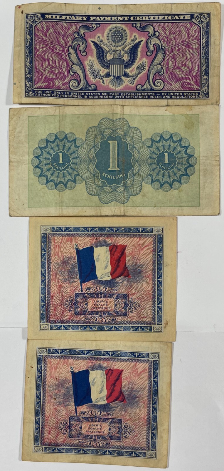Military currency 8 different pcs. (#472) includes one US. Mixed quality.