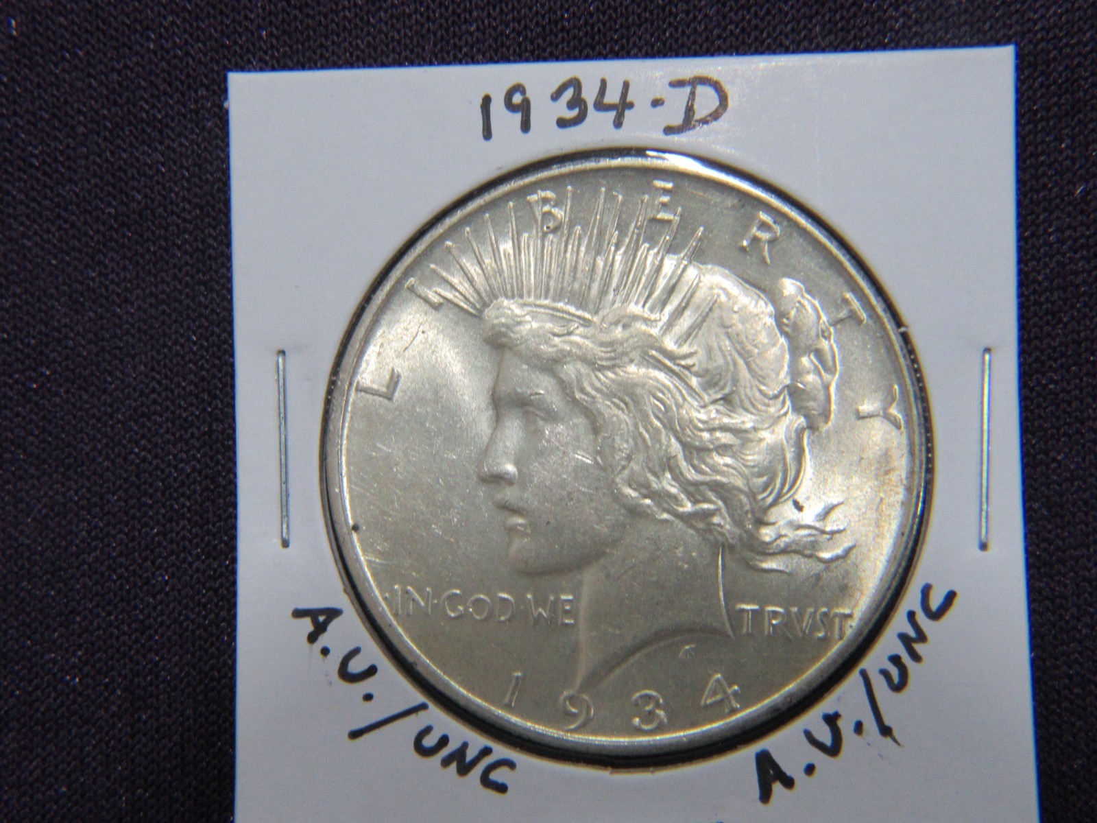 1934-D Peace dollar in A.U. / UNC condition