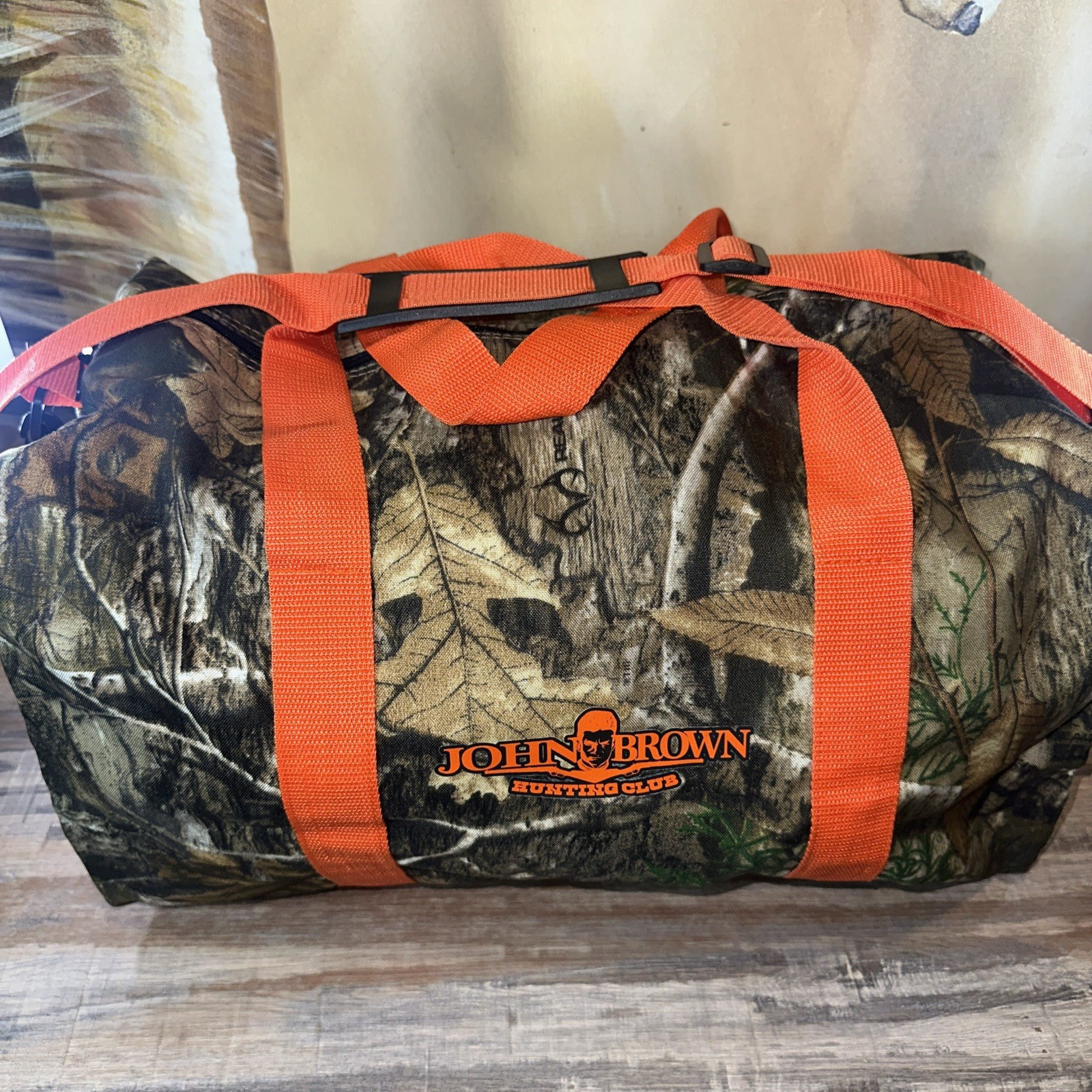 RealTree Camo Duffle Bag With Orange Trim John Brown Hunting Club