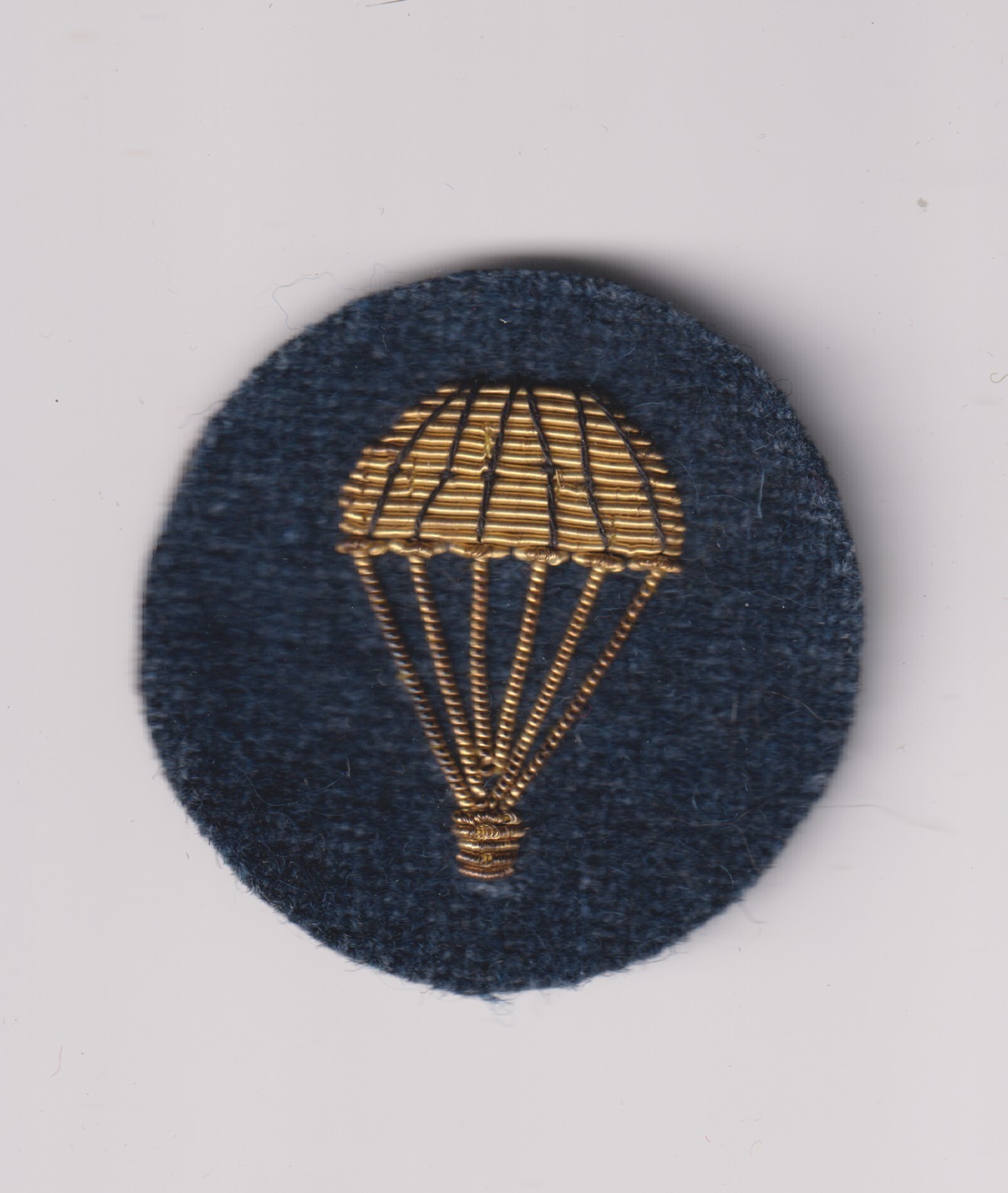 British parachute brevet lightbulb gold bullion on dark green-gray wool felt