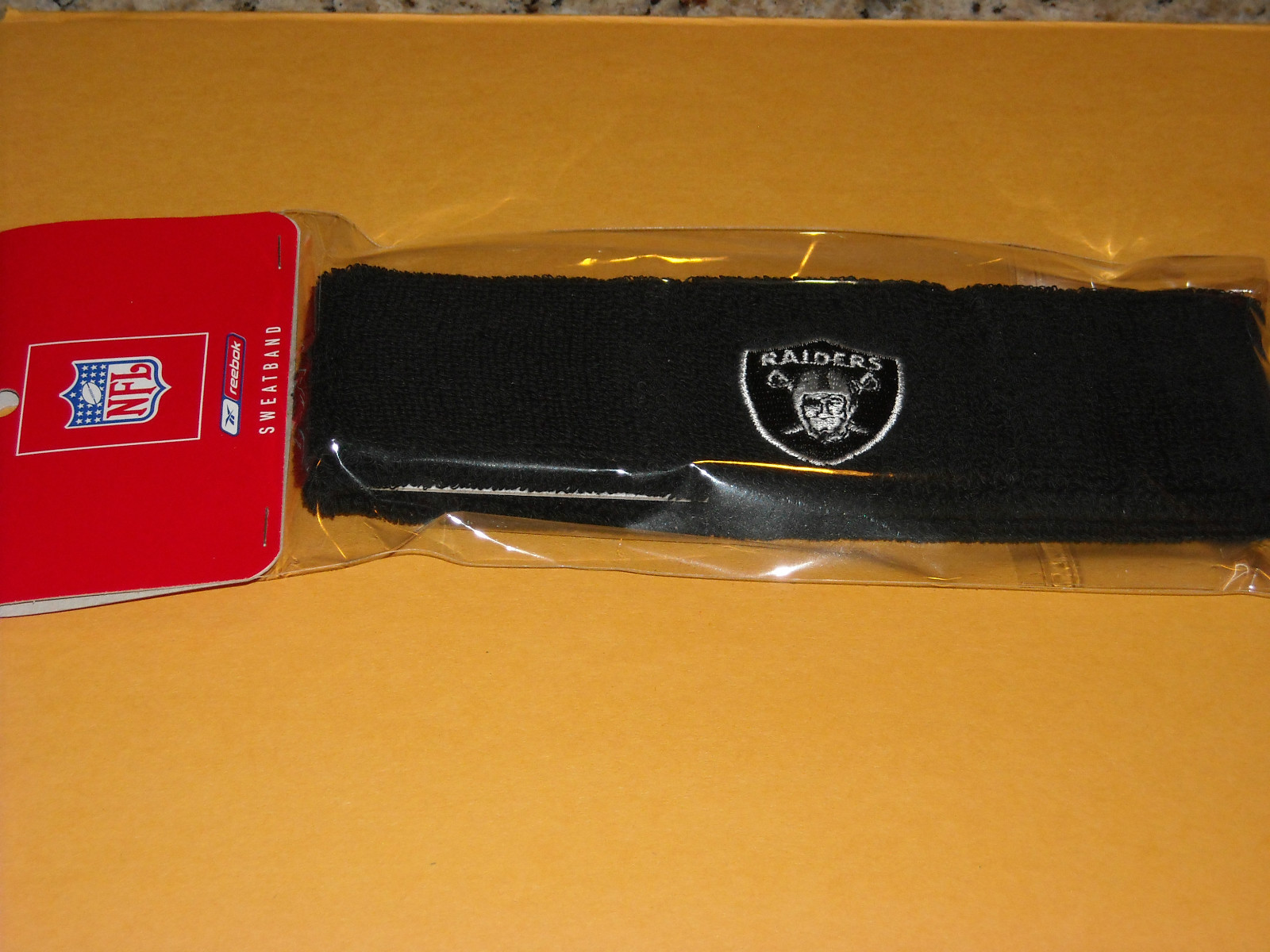 *NIP NFL OFFICIALLY LICENSED OAKLAND RAIDERS REEBOK HEADBAND SWEATBAND*
