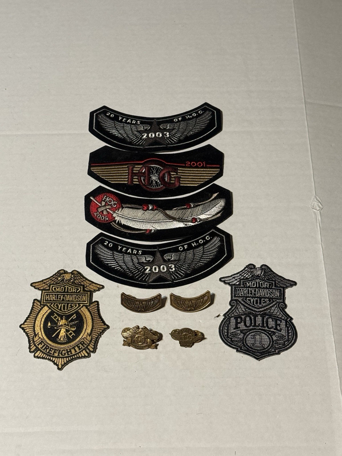 A lot of Harley Davidson patches and vest pins