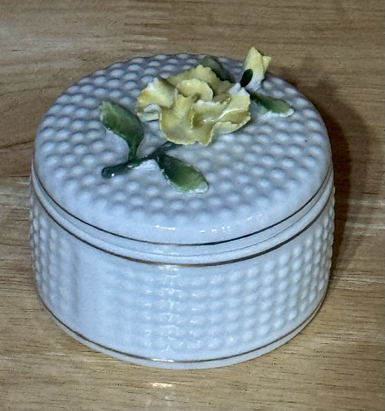 Trinket Box w/ A textured, dotted surface decorated w/ yellow flower; Germany