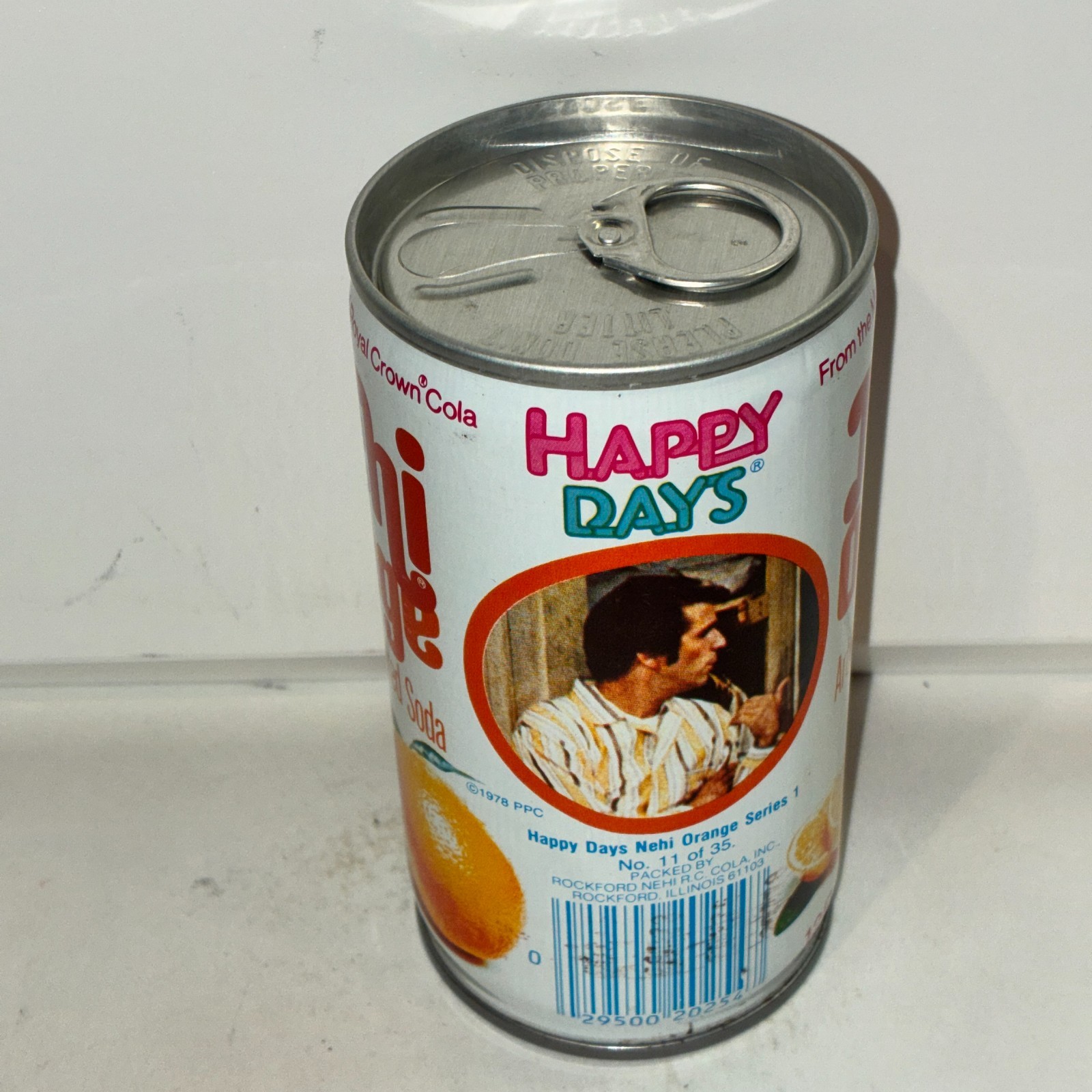 1970's Nehi Happy Days Orange Soda can, #11, bottom opened