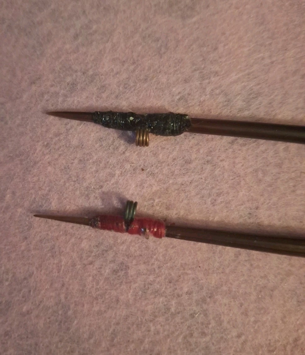 TWO HANDCRAFTED PORCUPINE QUILL FLOATS