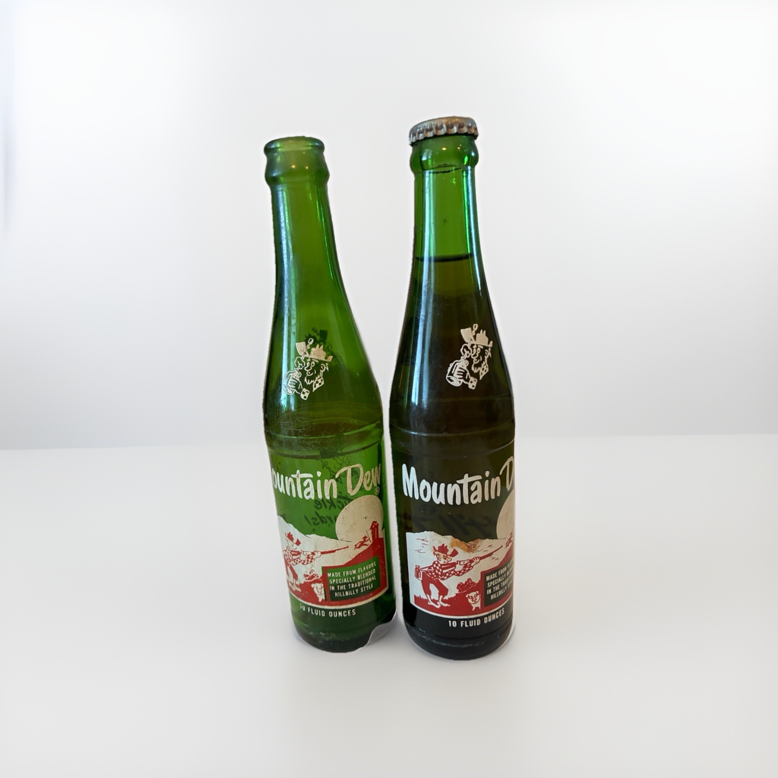 1967 Mountain Dew 10 Oz Hill Billy Glass Bottle. One Unopened