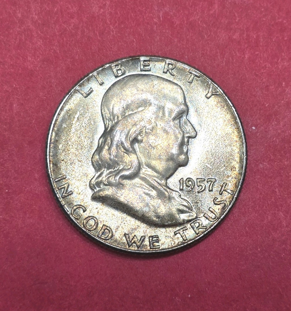 1957 Franklin Half Dollar Nicely Toned,  Full Bell Lines.
