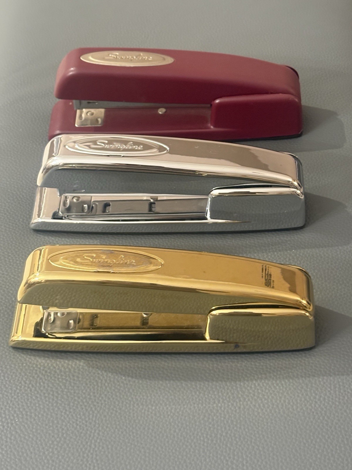 Set Of Three Standard Swingline Stapler. Colors Gold Silver And Burgundy