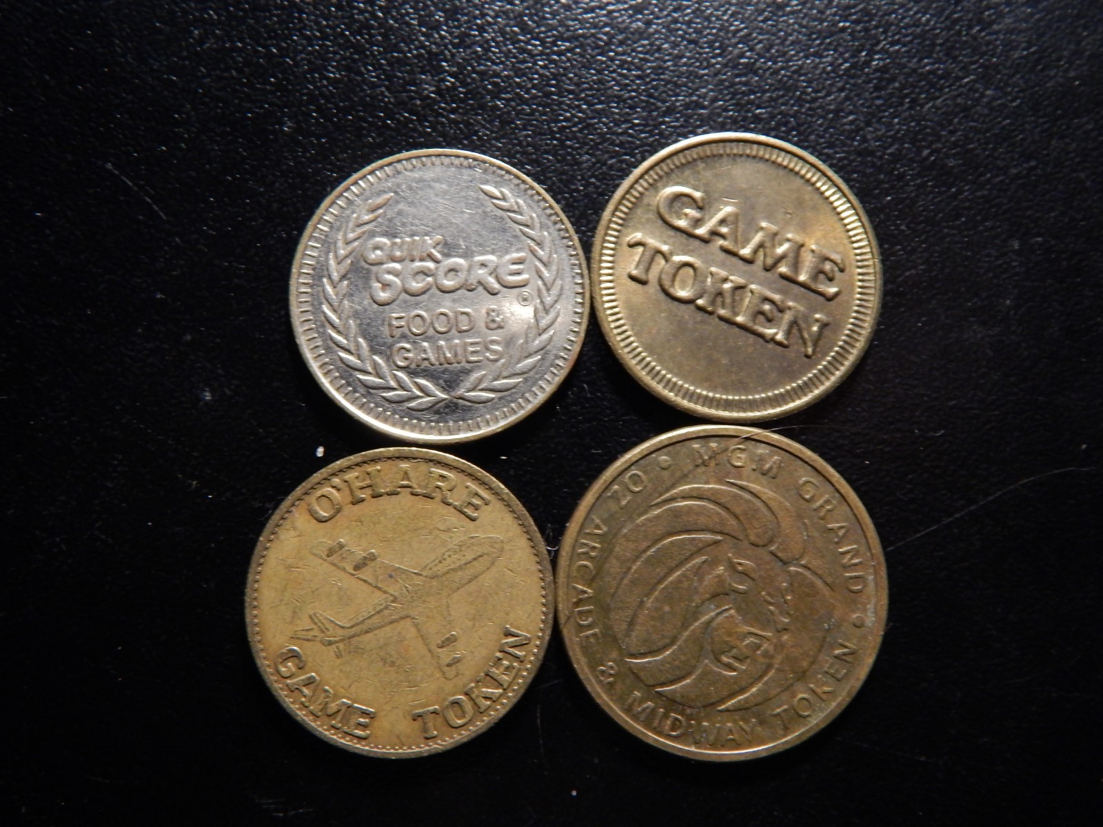 FOUR GAME TOKENS!   ZZ712XQX