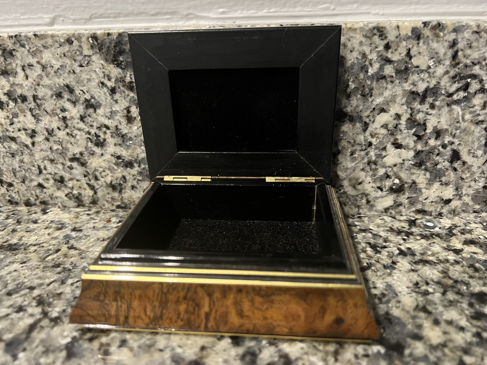 Brown hinged box with flowers on top