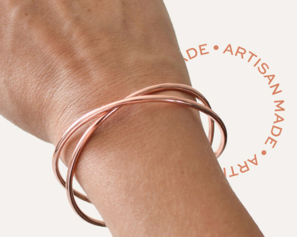 NEW, NEVER OPENED TRIBE ALIVE ROSE GOLD CRISS CROSS BRACELET