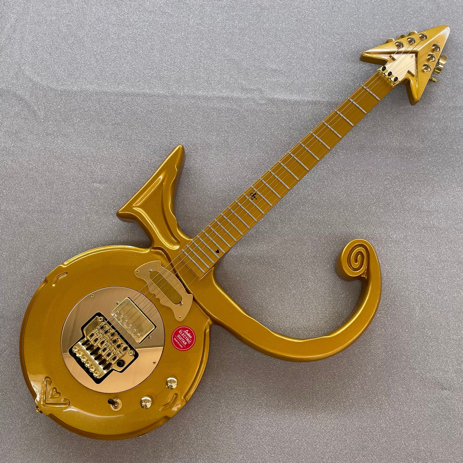 Unbrand gold top Prince Cloud Electric Guitar soild Body FR Bridge Arrow inllay