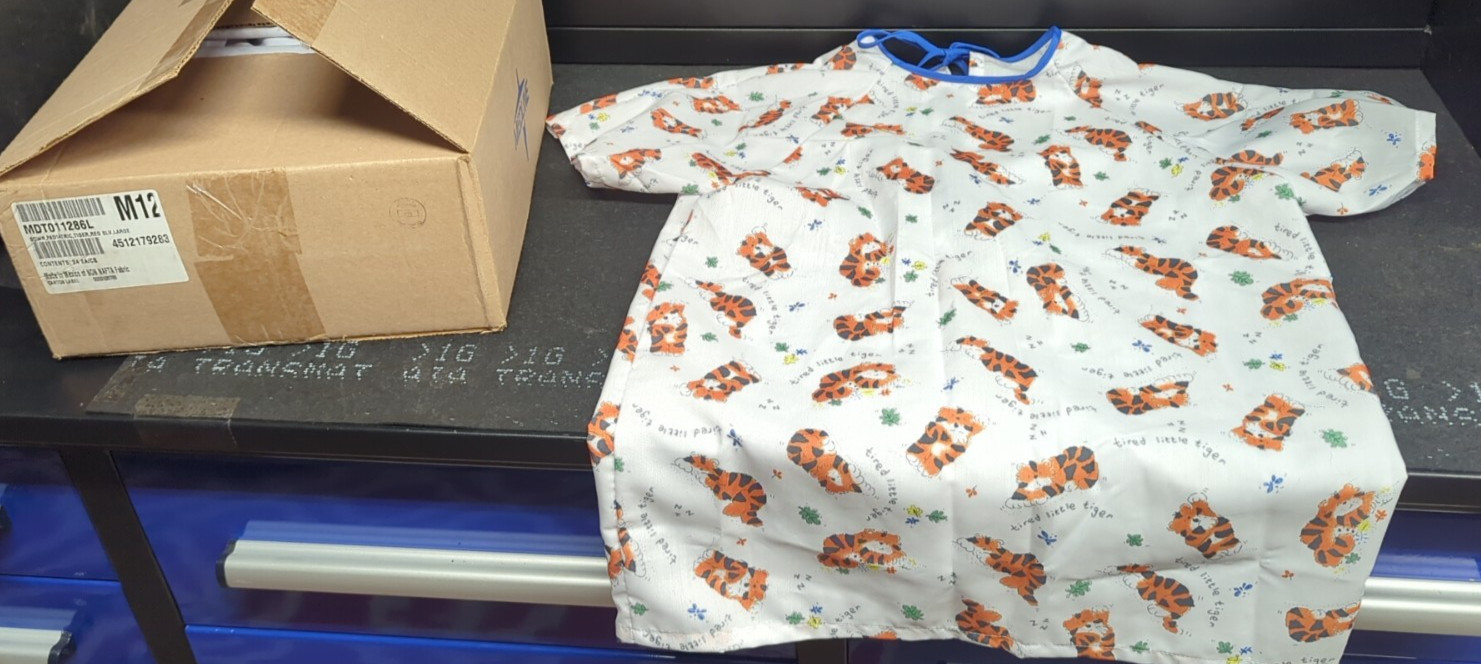 (1) Case Medline Pediatric Tired Tiger Print Pediatric large White Gown (24) pc