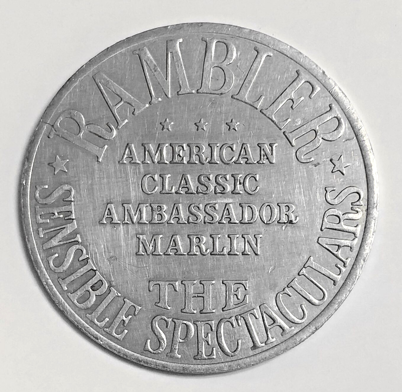 VTG Automotive Adv Coin: RAMBLER American Motors Corp AMBASSADORE MARLIN Dollar