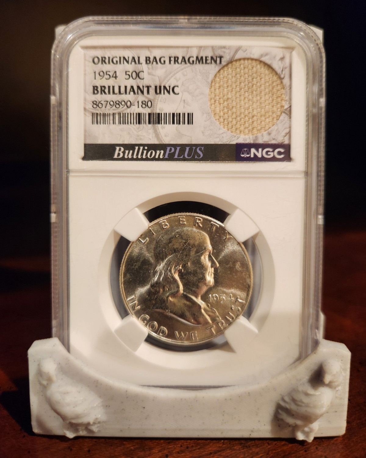 1954 Franklin Half Dollar 50C NGC Brilliant UNC w/original Bank Bag Fragment