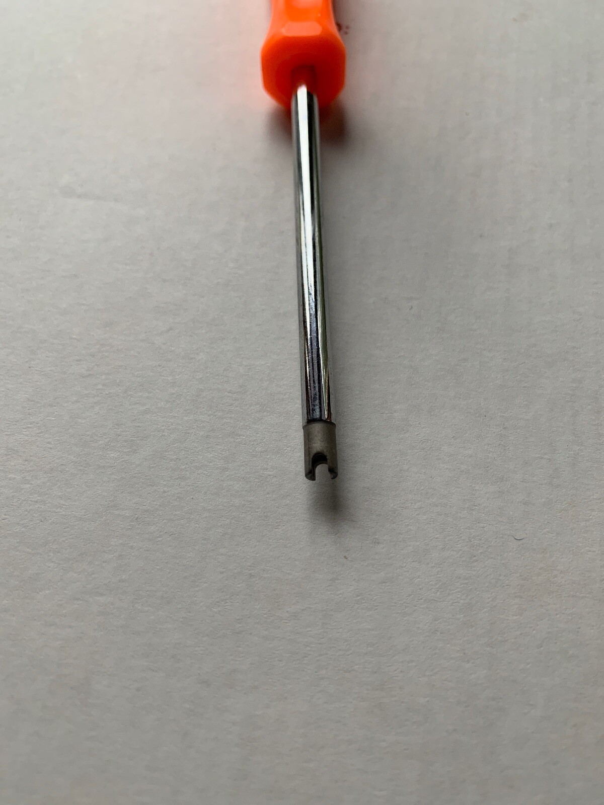 Snap-on Tire Valve Core Remover/Installer Tool. Orange handle