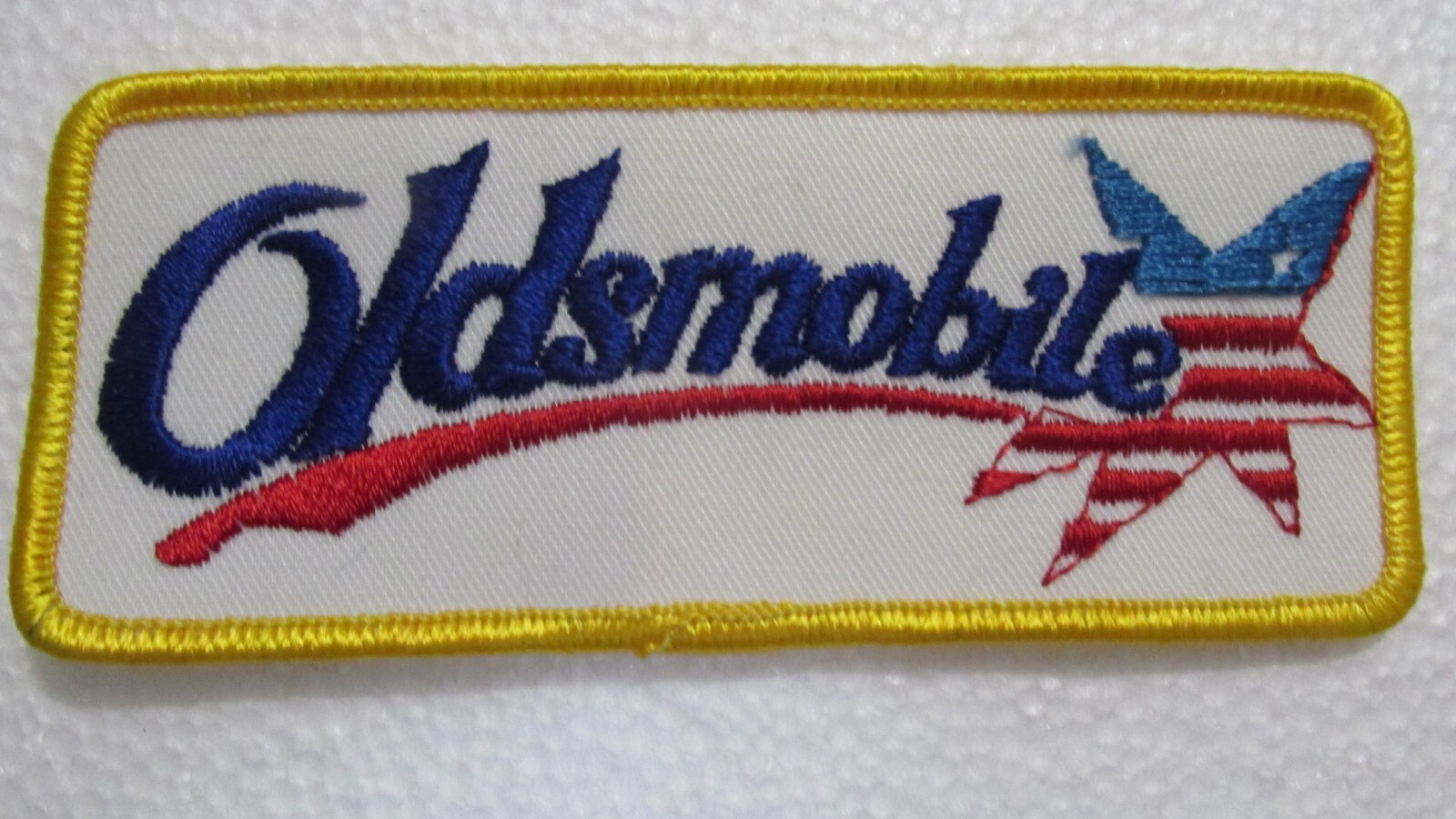 VINTAGE OLDSMOBILE EMBROIDERED PATCH RED WHITE BLUE NOS