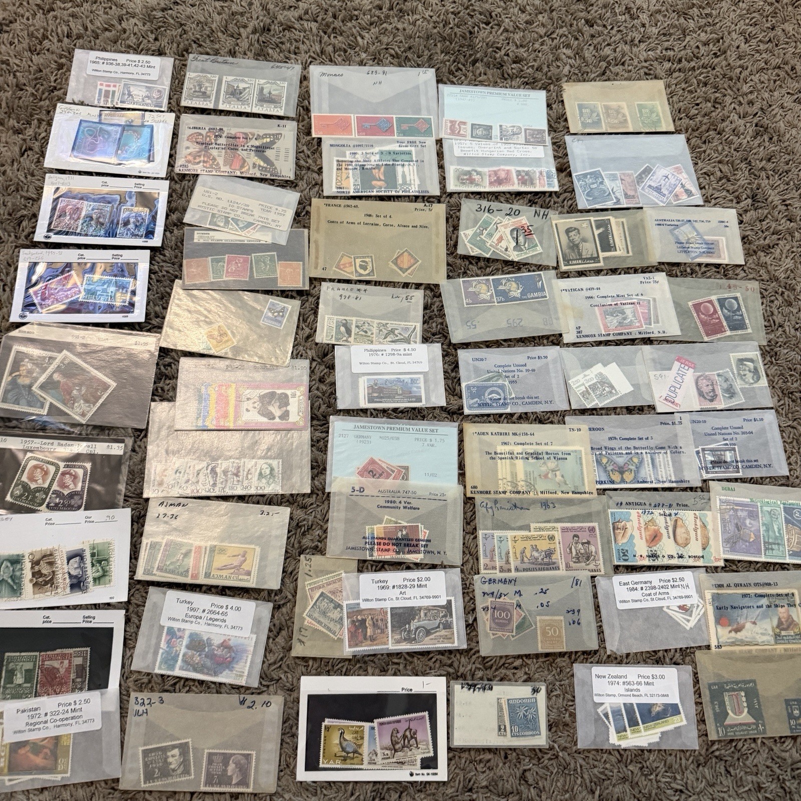 ESTATE LOT OF WORLDWIDE STAMP SETS SHORT SETS MINT USED SHELLS INLATION AND MORE